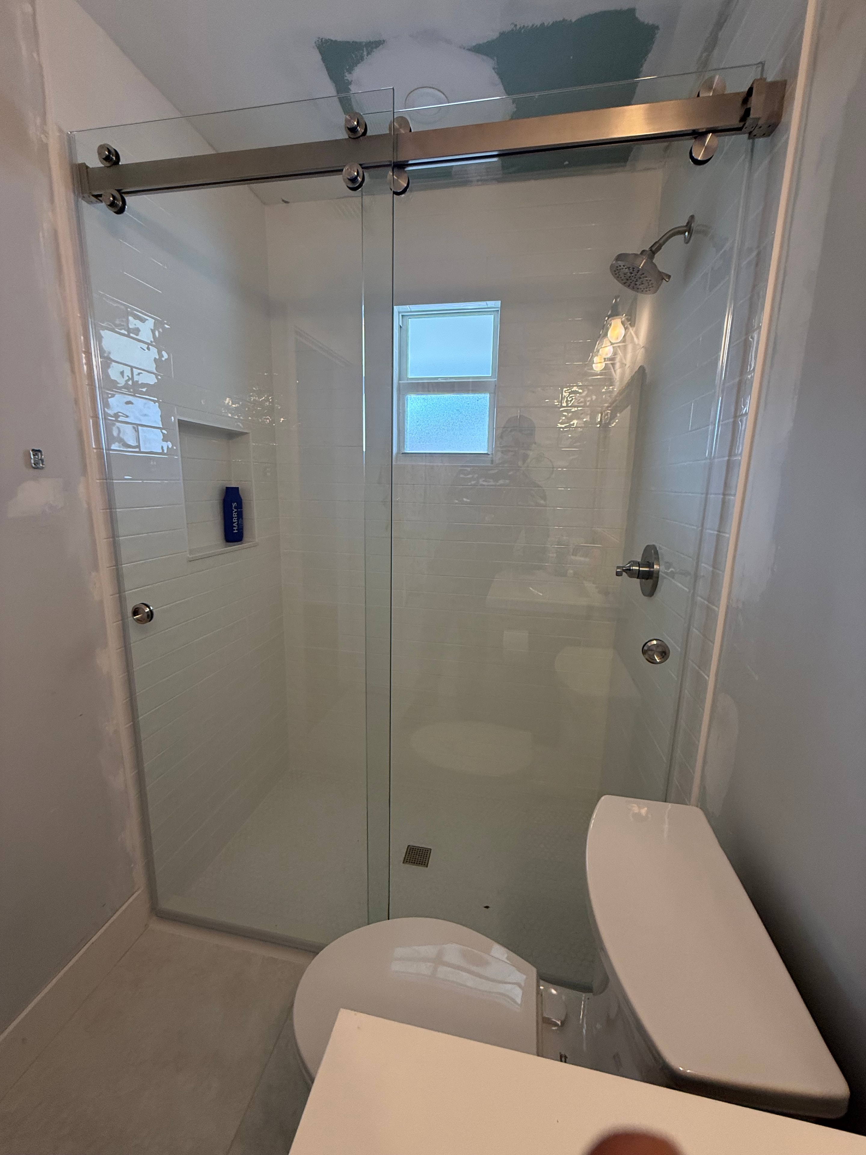 Serenity Series barn door shower enclosure installed by Clear Choice Glass in Jupiter, FL